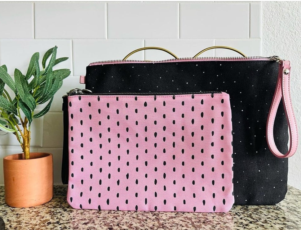 Pink pouch and black pouch on counter